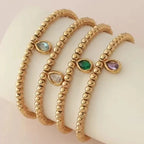 Bracelet doré avec pierre de naissance pour femme