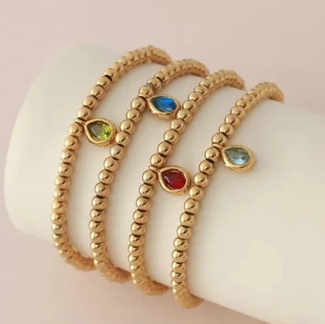 Bracelet doré avec pierre de naissance pour femme