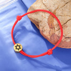 Bracelet en corde avec le symbole juif étoile de David rouge et or