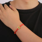 Bracelet en corde avec le symbole juif étoile de David rouge et or