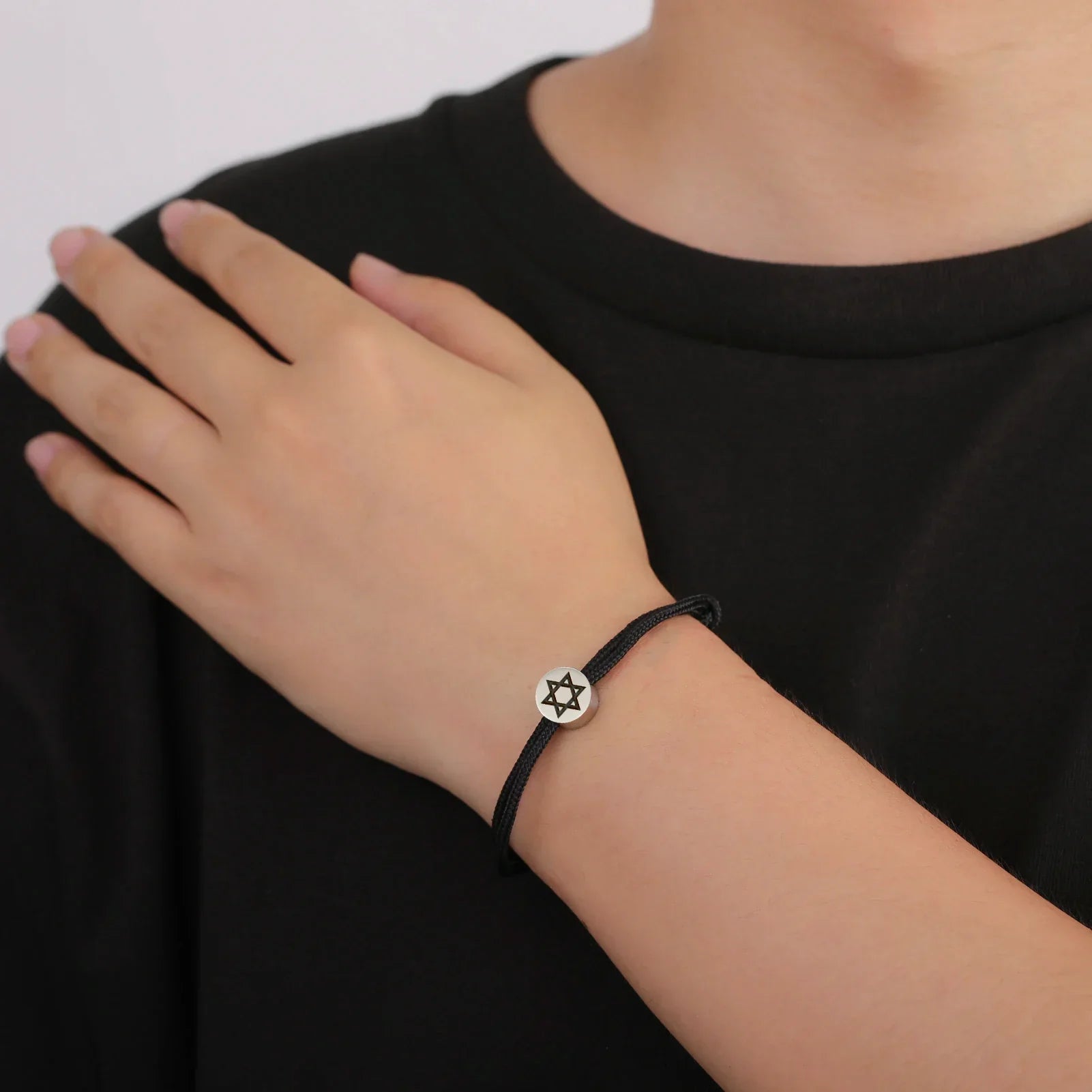 Bracelet en corde avec le symbole juif étoile de David noir et argent