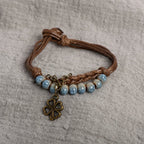 Cord Bracelet with Four-Leaf Clover and Blue Beads
