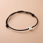 Cord Bracelet with White and Black Four-Leaf Clover