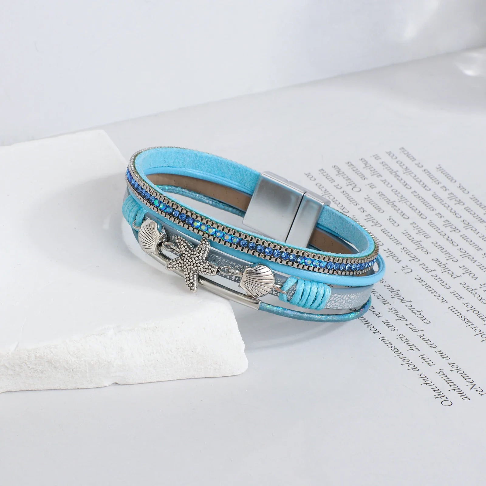 Bracelet en cuir coquillage et étoile de mer bleu