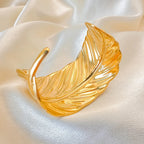 Bracelet manchette plume dorée