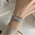 Bracelet plume argenté pour femme