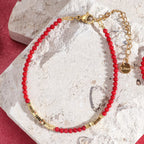 Bracelet rouge et doré corail