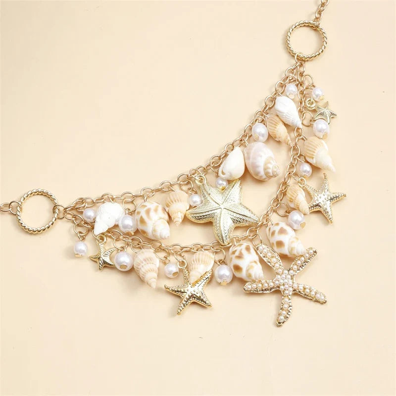 Collier avec grand pendentif coquillages et étoiles de mer
