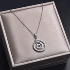 Collier avec grand pendentif spirale ajourée argent