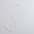 Collier avec large pendentif ailes d'ange argent