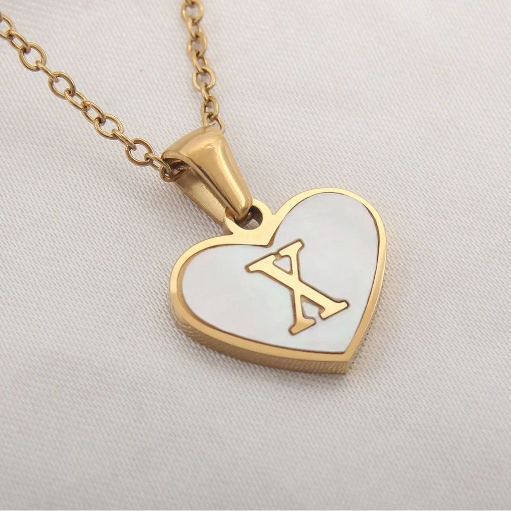 Collier avec pendentif coeur blanc initiale x