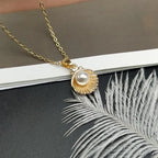 Necklace with Scallop Shell and Gold Pearl Pendant