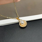 Necklace with Scallop Shell and Gold Pearl Pendant