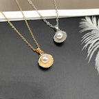 Necklace with Scallop Shell and Gold Pearl Pendant