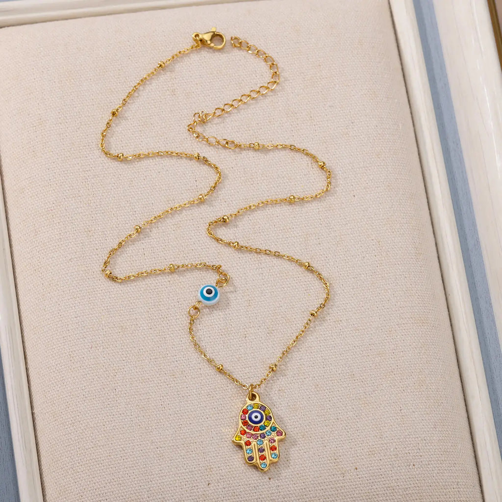 Collier avec pendentif de protection contre le mauvais œil et main de Fatma multicolore arabe