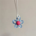 Necklace with Light Blue Colored Flower Pendant