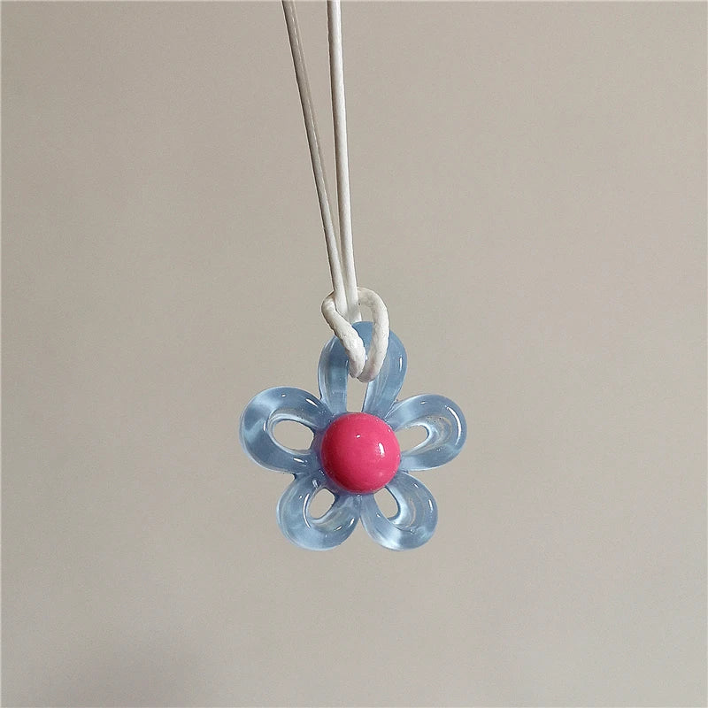 Necklace with Light Blue Colored Flower Pendant