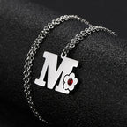 Collier avec pendentif initiale et fleur m