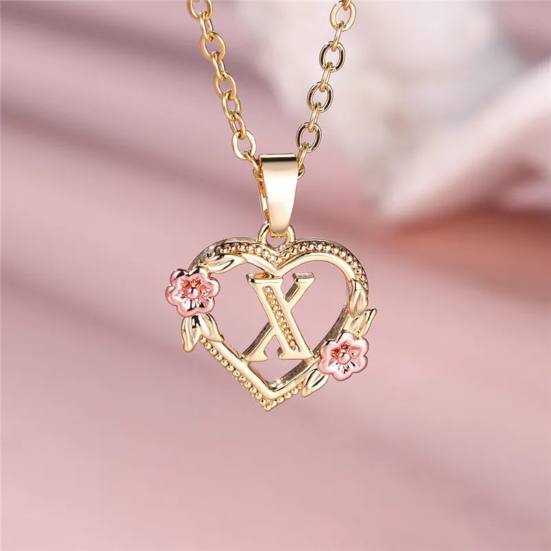 Collier avec pendentif initiale coeur et fleurs x