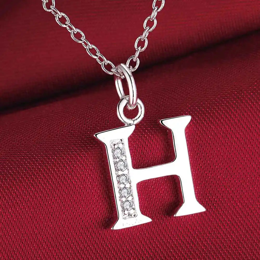 Collier long avec pendentif initiale  h