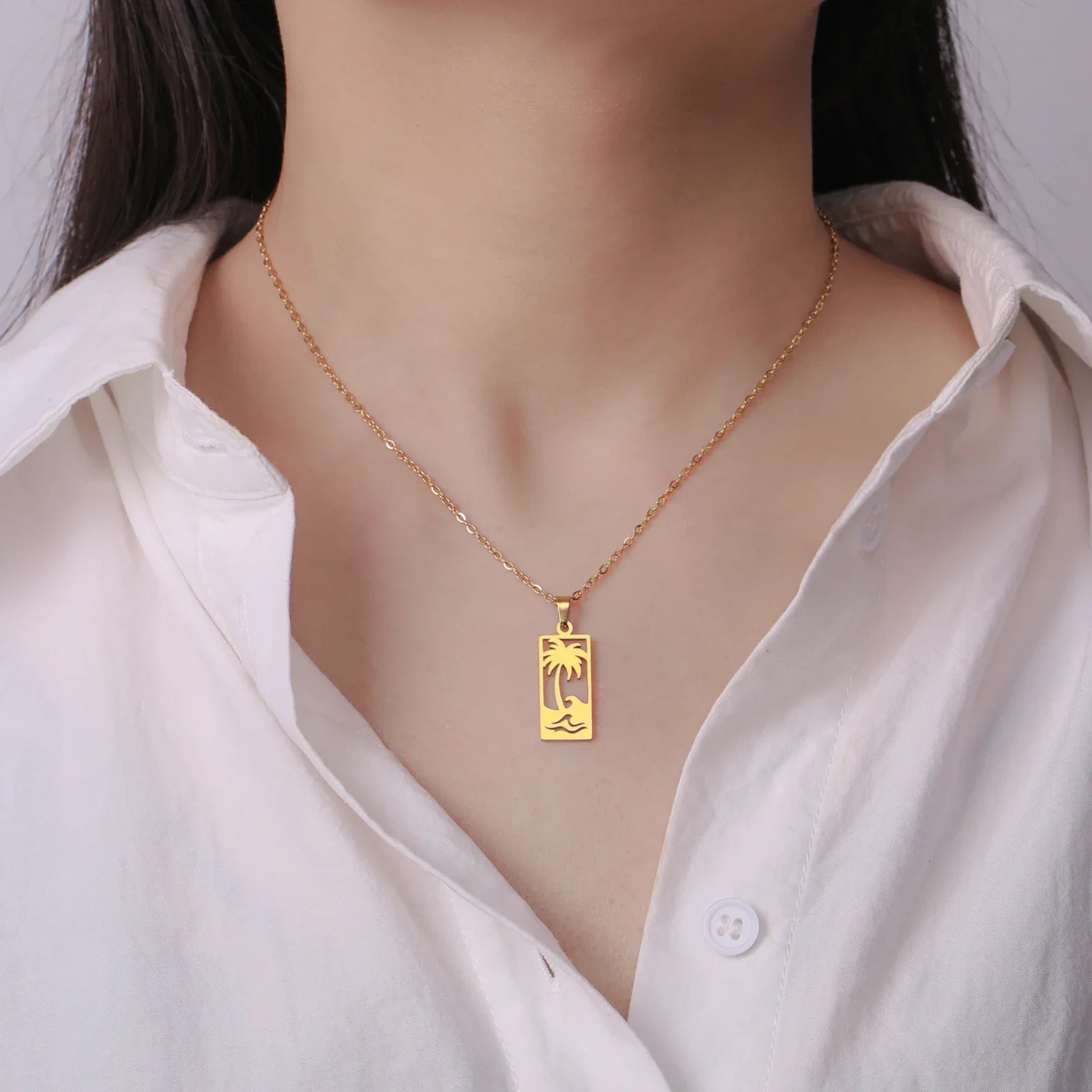 Collier avec pendentif palmier et vague de plage or