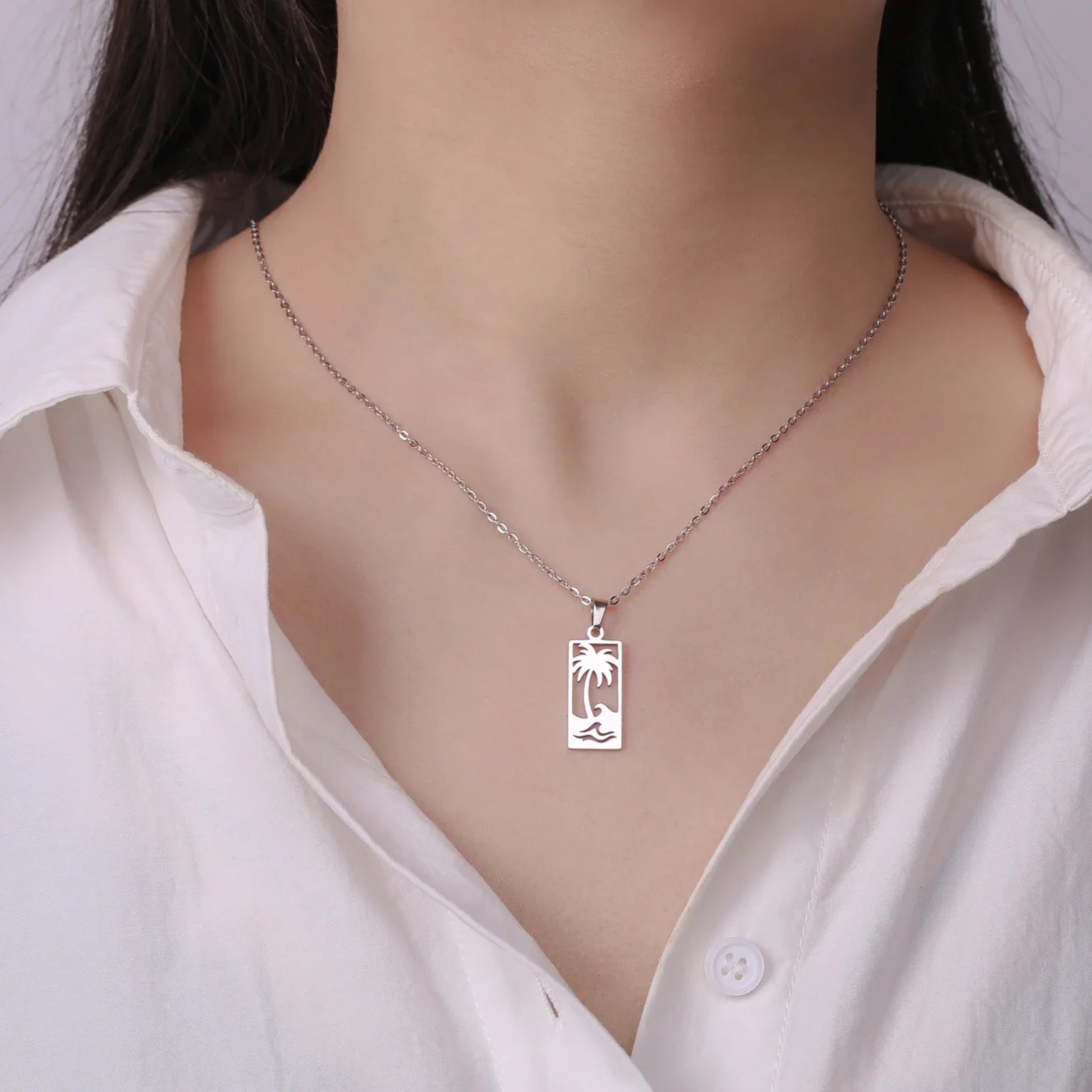 Collier avec pendentif palmier et vague de plage argent