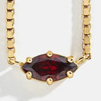 Collier avec pendentif pierre de naissance en forme d'oeil janvier