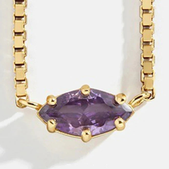 Collier avec pendentif pierre de naissance en forme d'oeil février