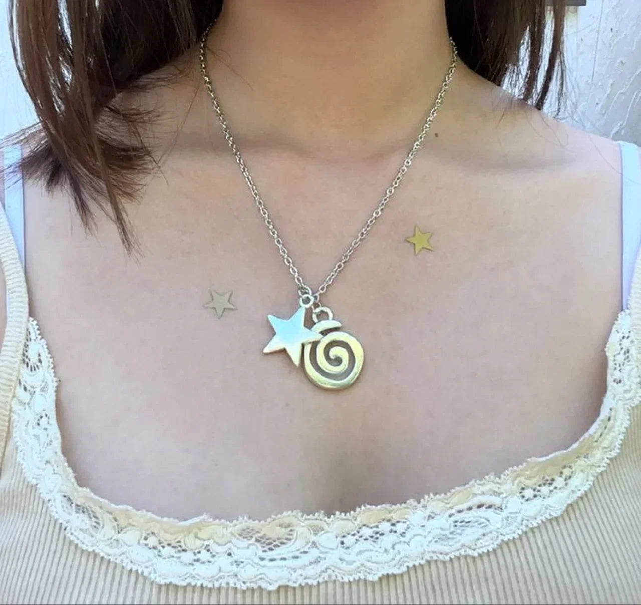 Collier avec pendentif spirale et petite étoile