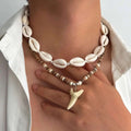 Lot de 2 colliers bohème coquillages et pendentif dent de requin blanc