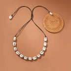 Collier coquillage cauri blanc noir