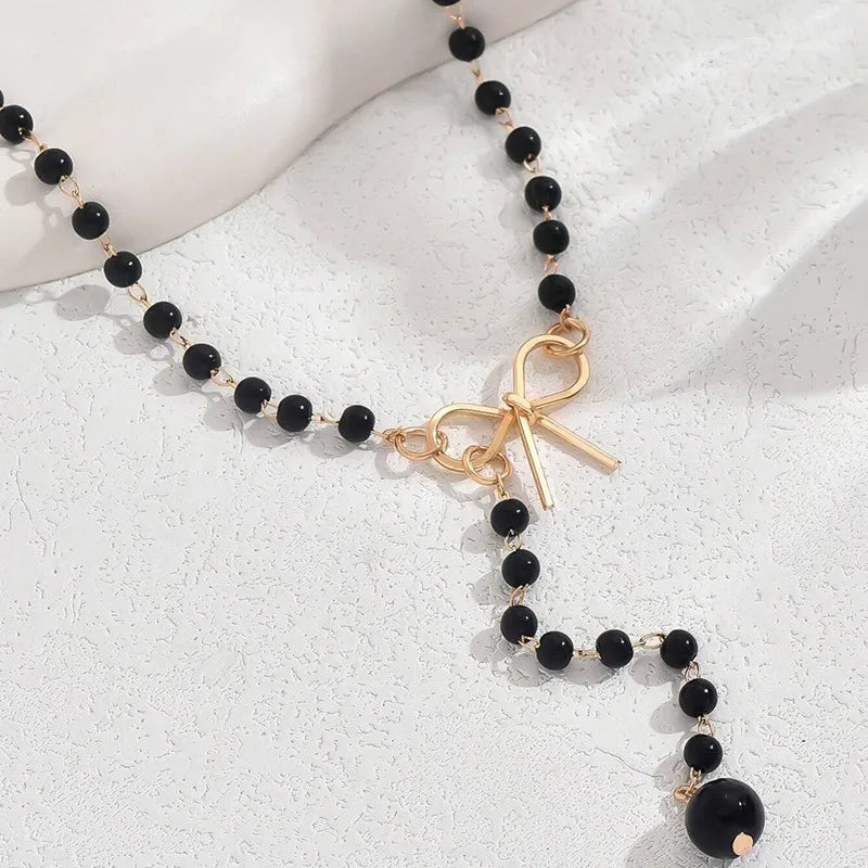 Pearl Necklace with Black Knot Pendant