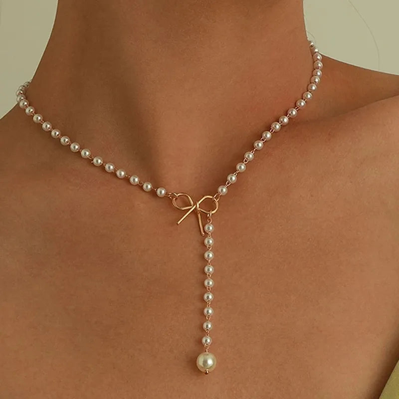Pearl Necklace with White Knot Pendant
