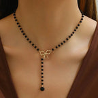 Pearl Necklace with Black Knot Pendant