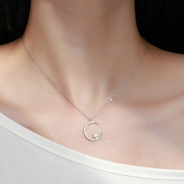 Sparkling necklace with star and moon pendant 