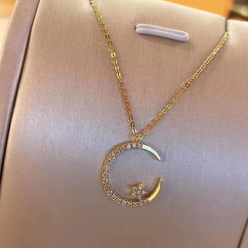 Sparkling necklace with star and moon pendant 