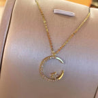 Sparkling necklace with star and moon pendant 