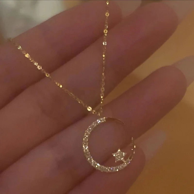 Sparkling necklace with star and moon pendant 