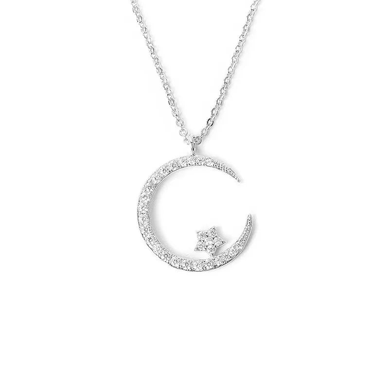 Sparkling necklace with star and moon pendant 