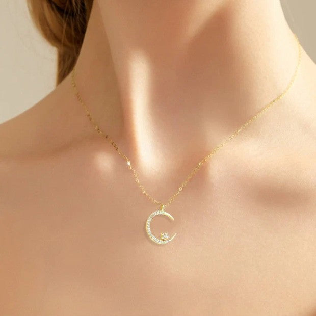 Sparkling necklace with star and moon pendant 