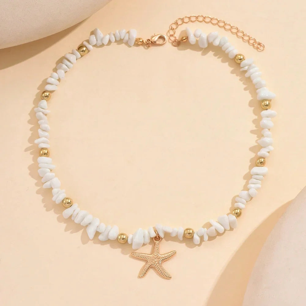 Collier ras du cou coquillage et étoile de mer blanc larges perles
