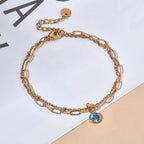 Double bracelet doré avec pierre de naissance