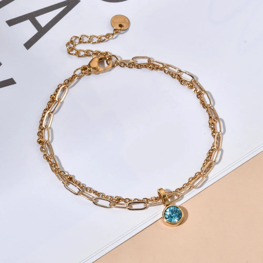 Double bracelet doré avec pierre de naissance