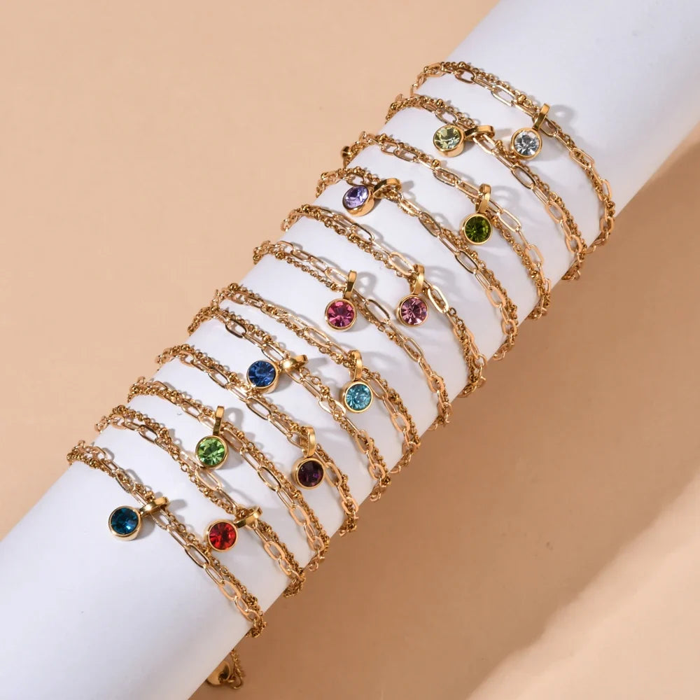 Double bracelet doré avec pierre de naissance janvier