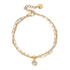 Double bracelet doré avec pierre de naissance