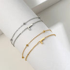 Bracelet double initiale or et argent l