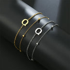 Bracelet double initiale or et argent  q
