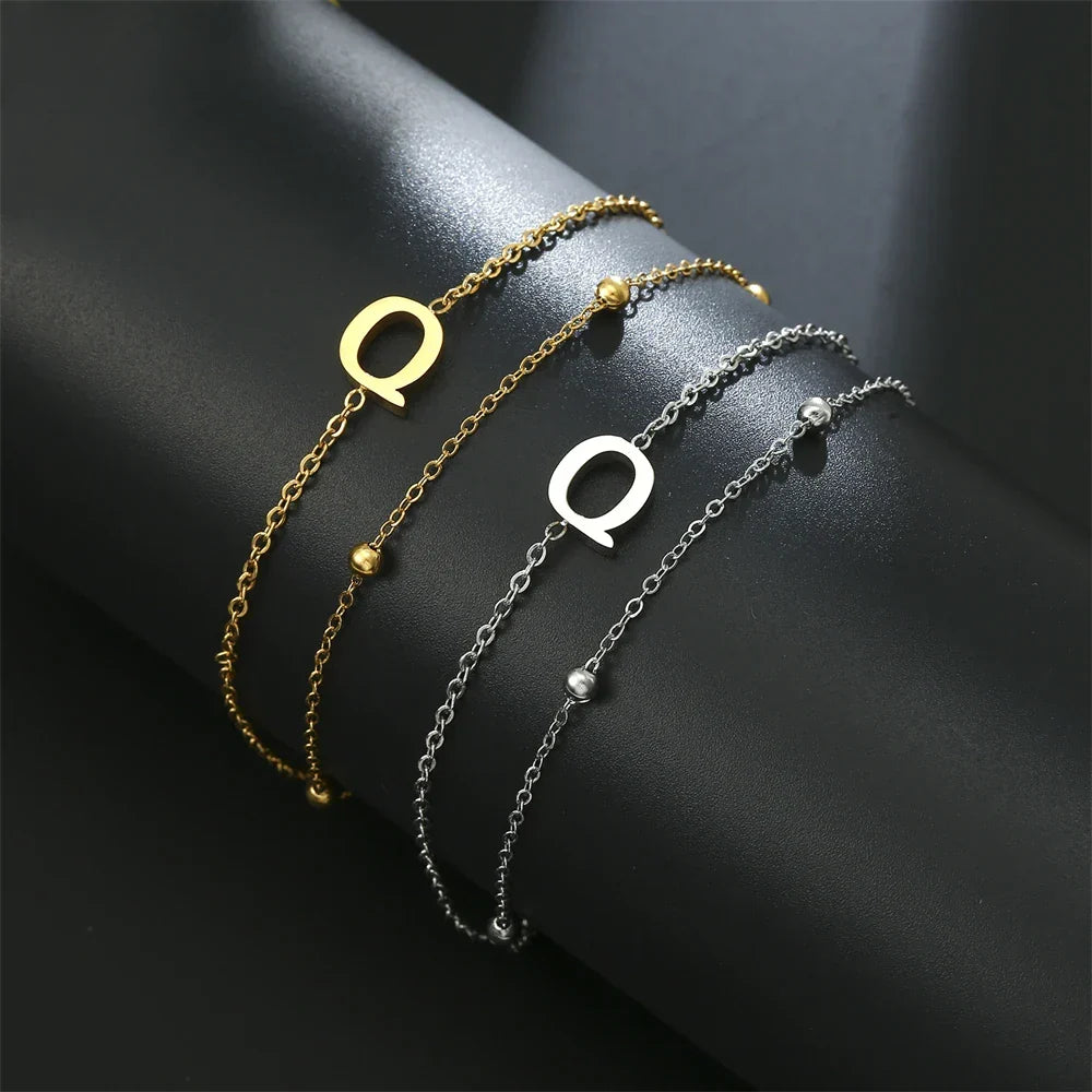 Bracelet double initiale or et argent  q