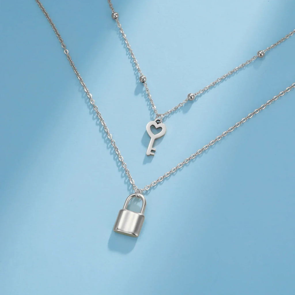 Collier double avec pendentif clef et cadenas argent