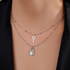 Collier double avec pendentif clef et cadenas argent
